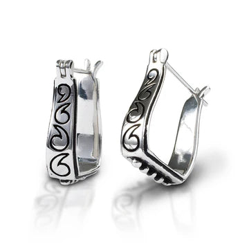 Pair of silver hoop earrings with intricate designs 