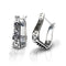 Pair of silver hoop earrings with intricate designs 