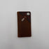 Brown leather wallet with decorative elements on a white background