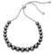 A silver pearl bracelet with a slide closure.