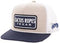 Trucker hat with 'Cactus Ropes Texas' logo on a beige and navy background