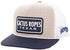 Trucker hat with 'Cactus Ropes Texas' logo on a beige and navy background