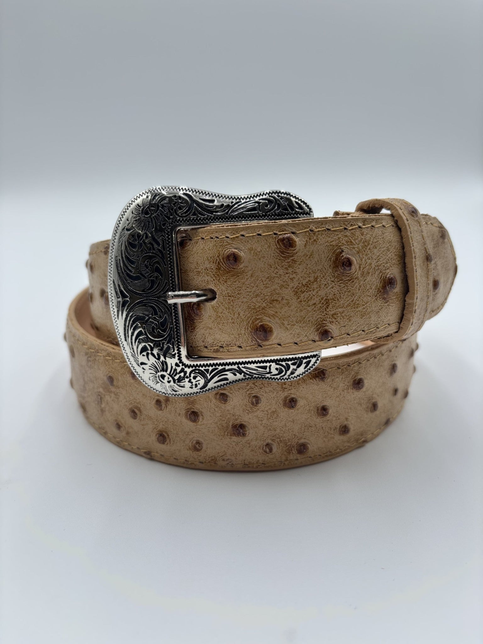 Tan Belt with Ostrich, with a floral tooled buckle.
