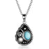 Silver necklace with a decorative pendant featuring a blue gemstone 