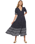 navy blue dress with white dots and a patterned hemline and button down the front.