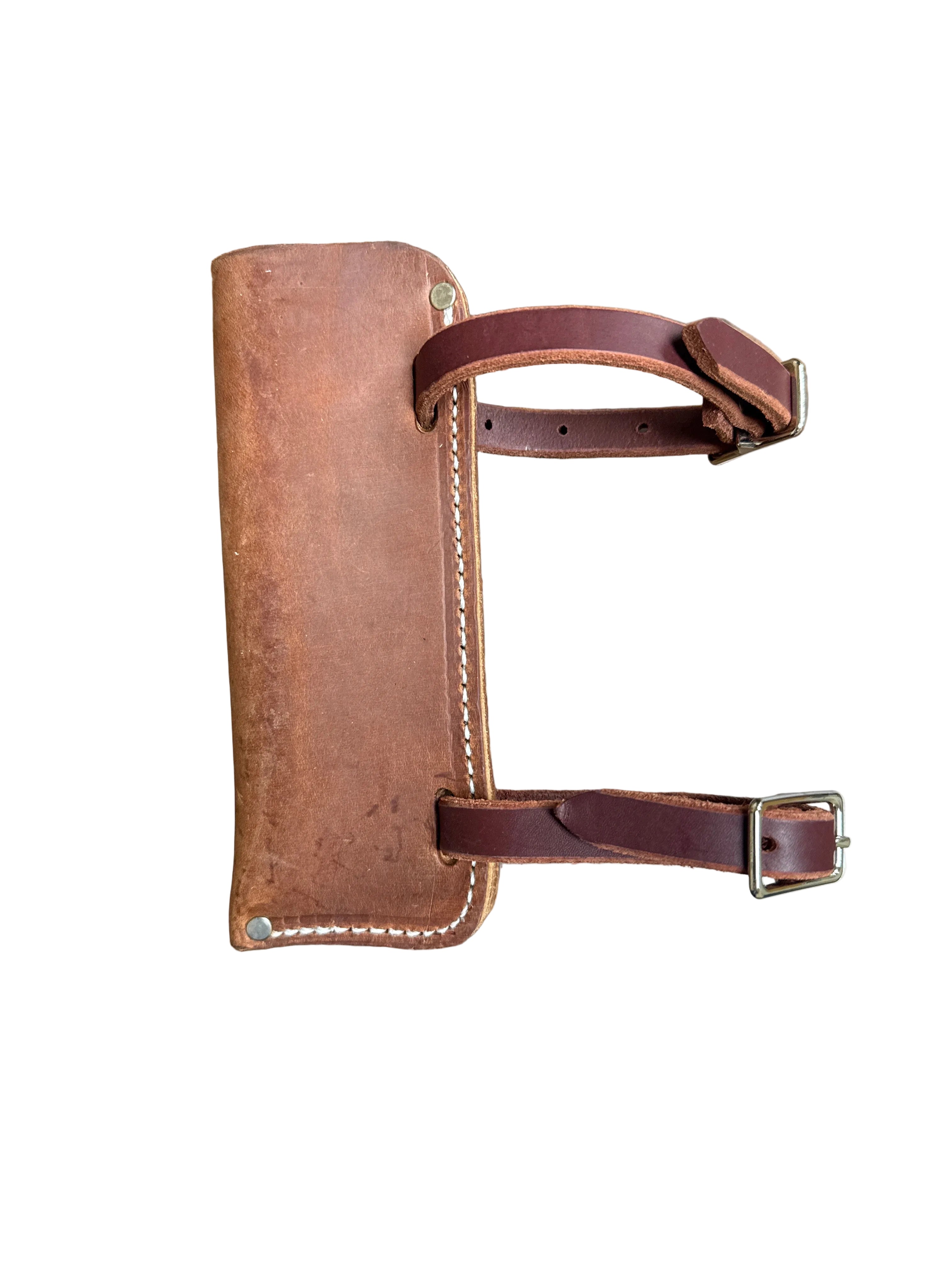 A brown leather holder to carry flags on horseback