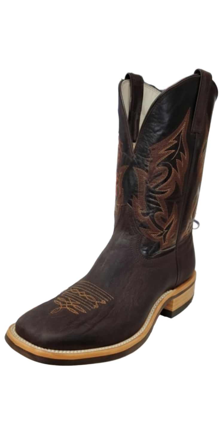 A brown nubuck bullhide boot with a square toe and decorative stitching