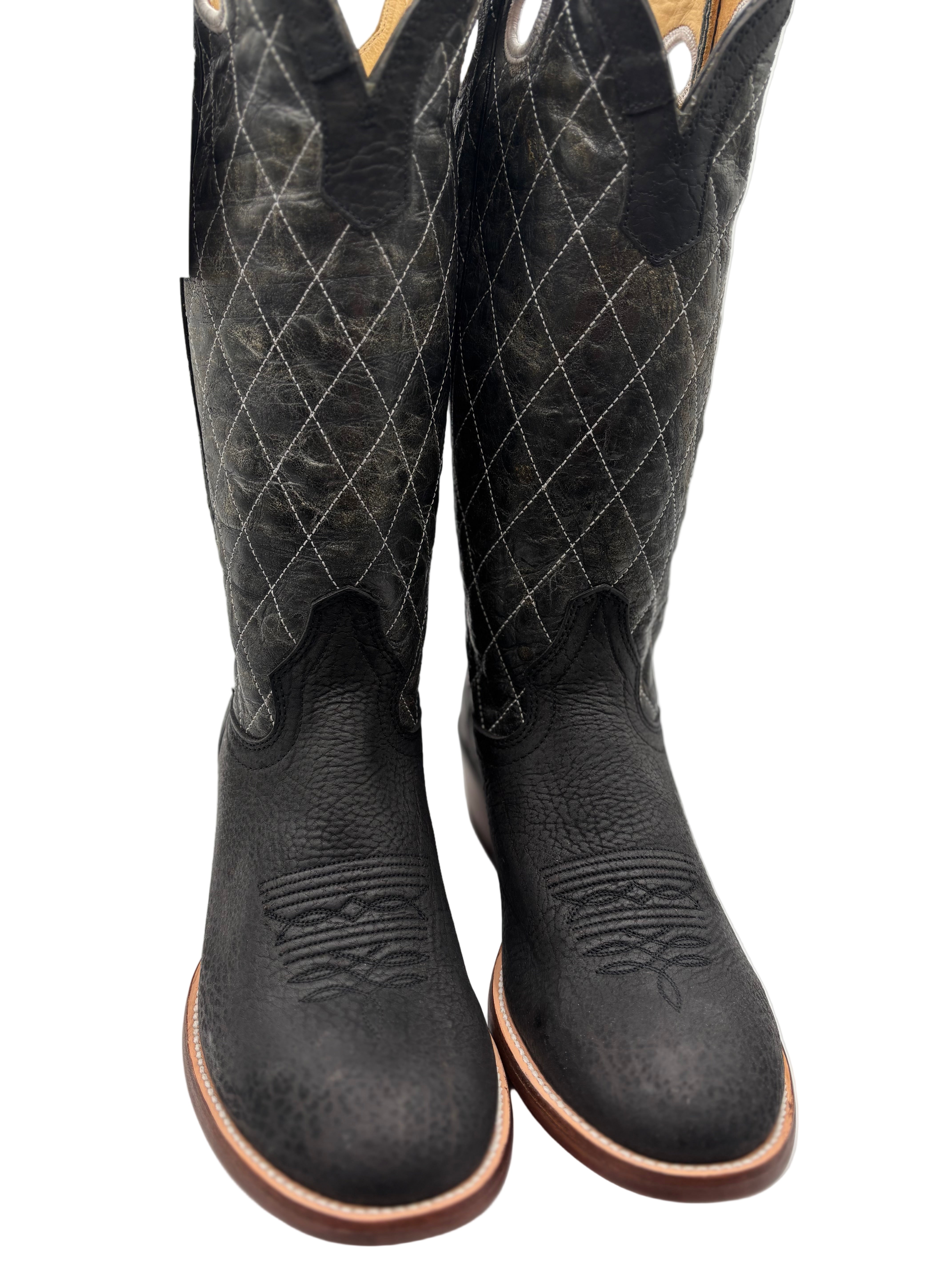 Pair of black leather cowboy boots with diamond pattern