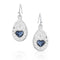 Silver earrings with blue heart stones on a white background