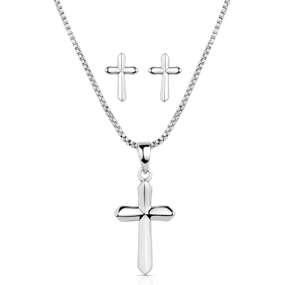 Silver cross necklace and earrings on a white background