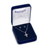Silver cross necklace and earrings in a Montana Silversmiths box on a white background