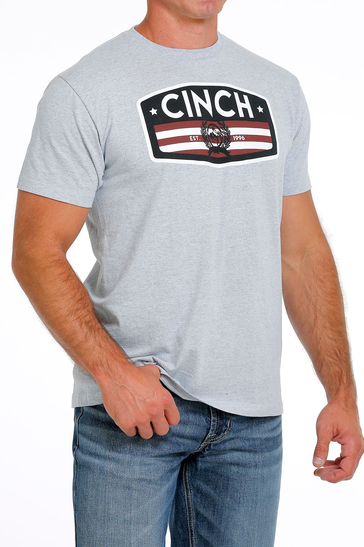 light blue t-shirt with a Cinch logo on 