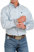 Man  light blue button-up shirt with rolled sleeves 