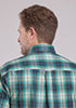 Man wearing a plaid shirt with a visible brand logo.