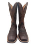 Pair of brown cowboy boots with intricate designs 