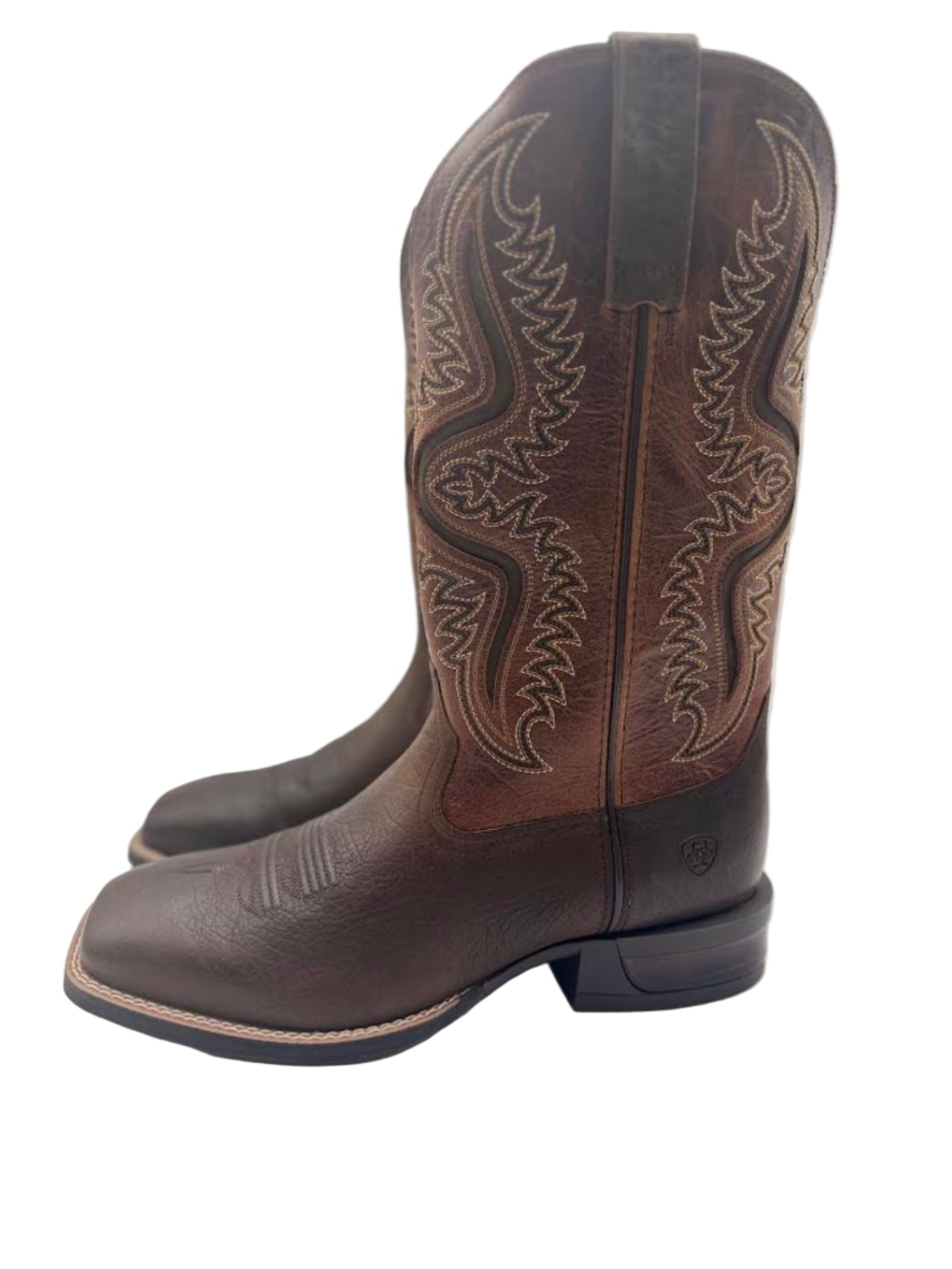 Pair of brown cowboy boots with  stitching 