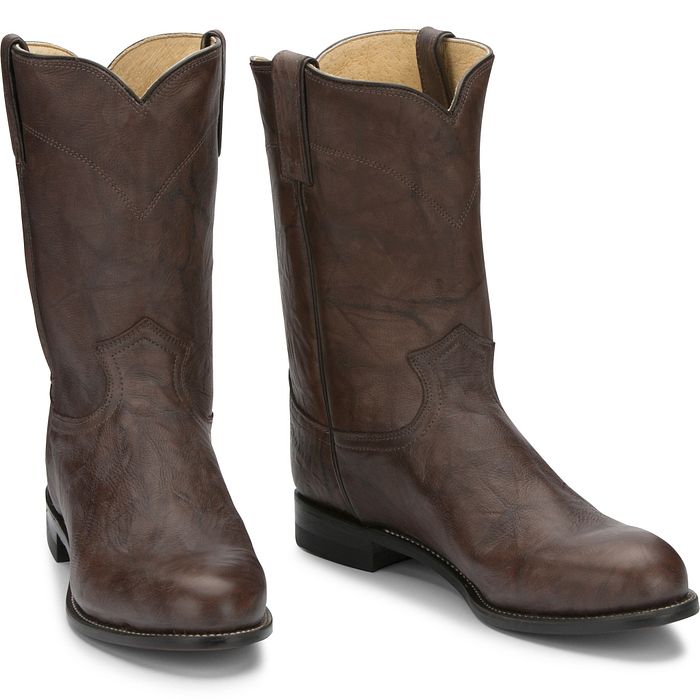 Pair of brown leather boots on a white background