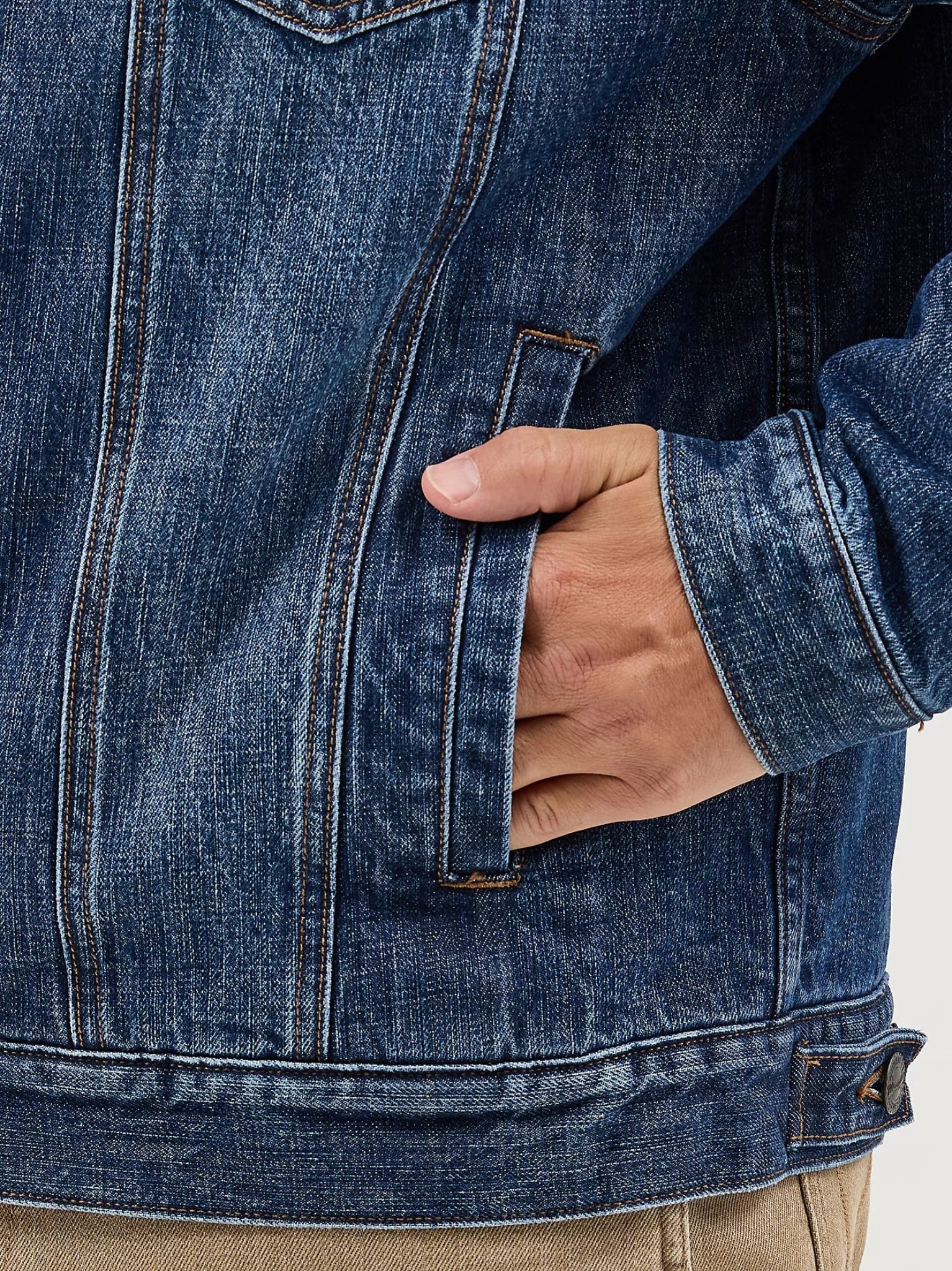 Close-up of a person wearing a blue denim jacket