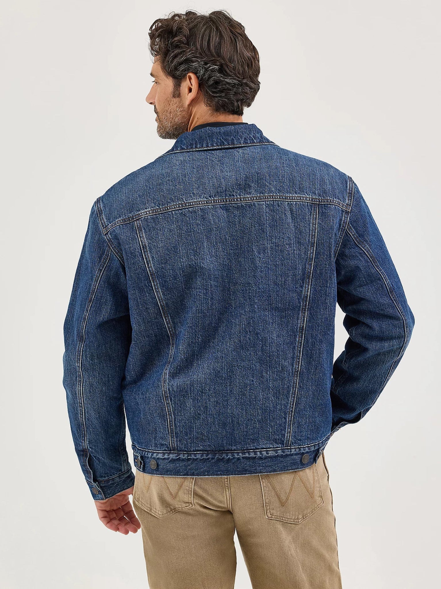 Man wearing a blue denim jacket 