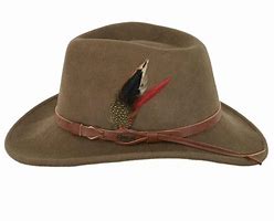 A brown wool outback hat with a decorative emblem on the front and a brown band.