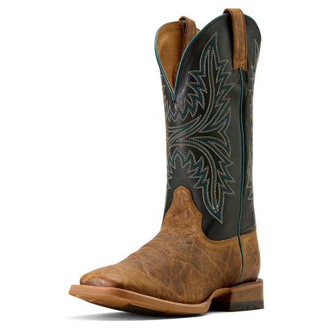 Brown cowboy boot with intricate black and green stitching 