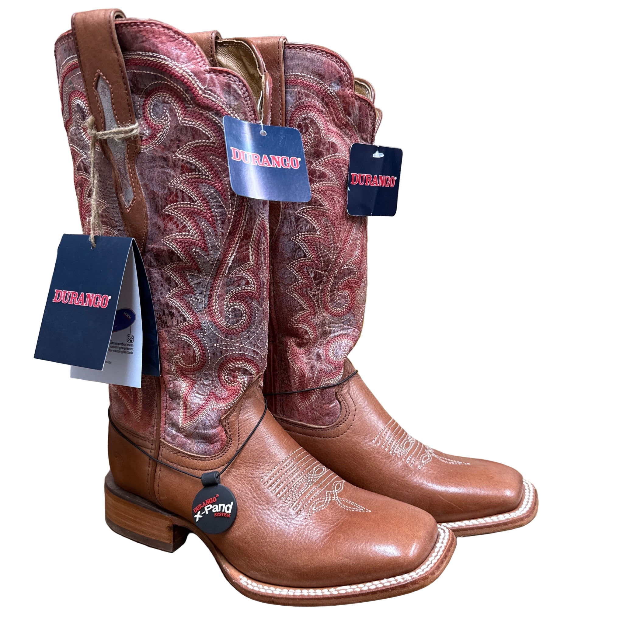 Pair of ladies brown cowboy boots with intricate designs 