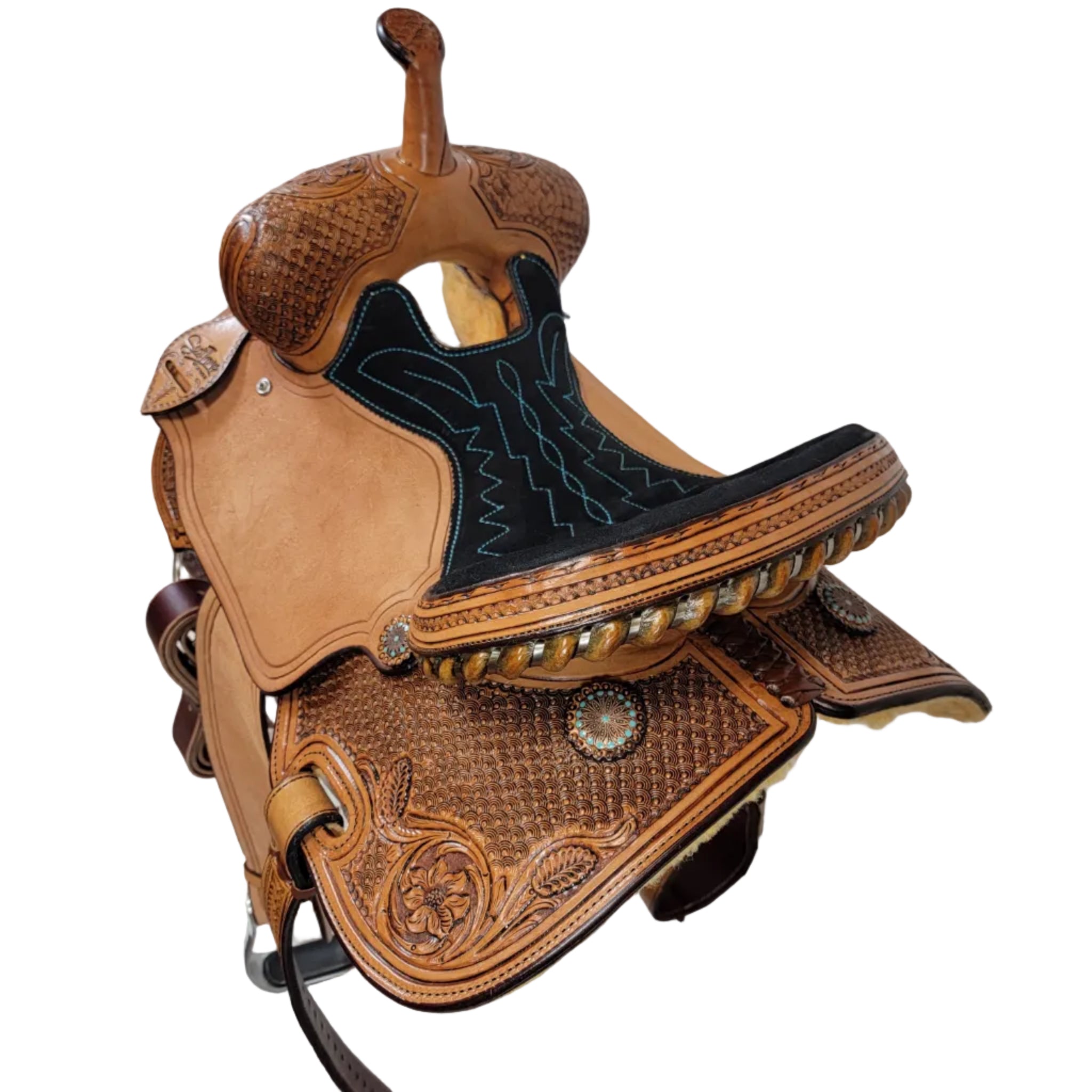 Close-up of a brown leather saddle with intricate designs on a white background