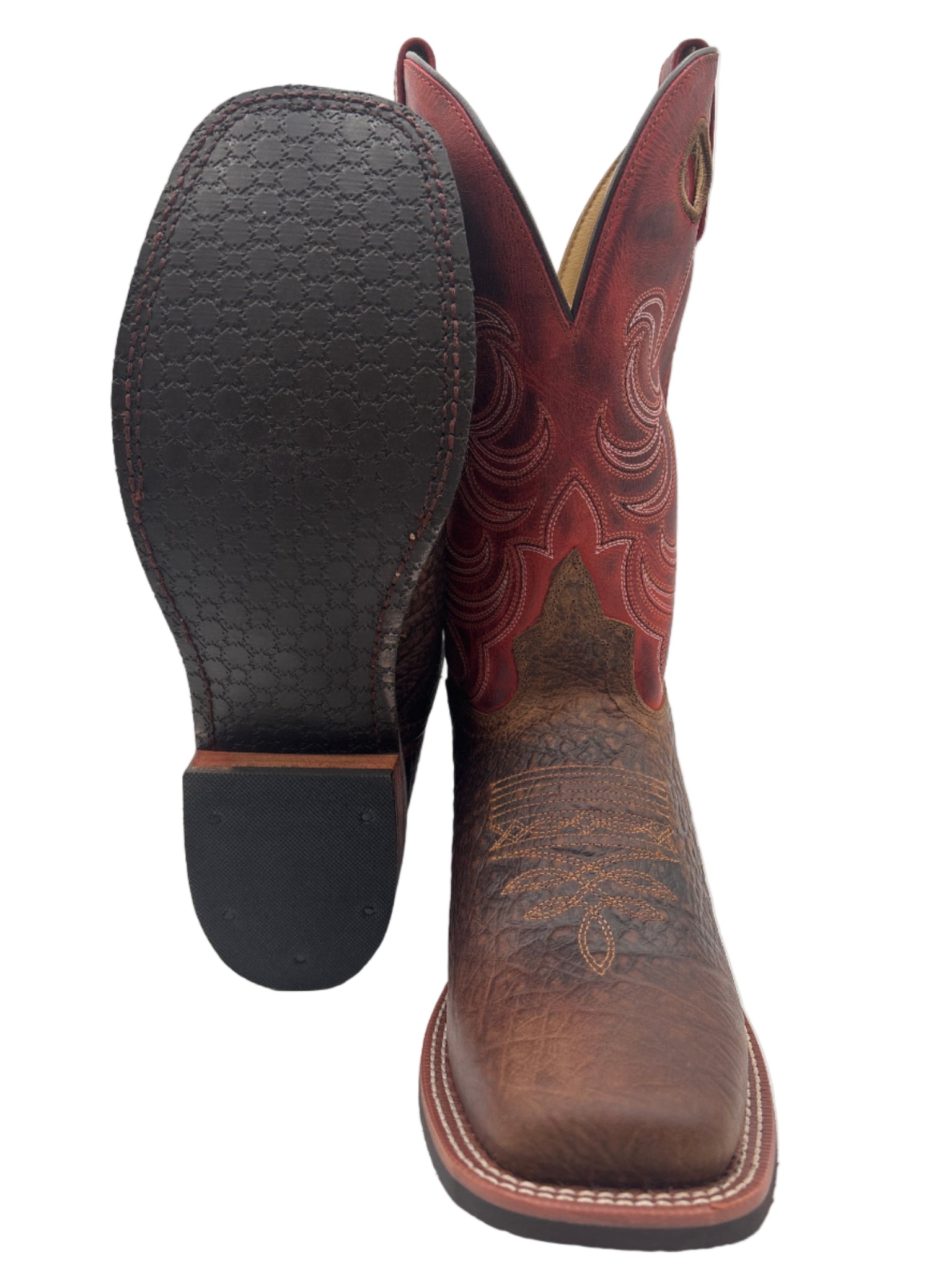 Pair of brown cowboy boots with intricate designs 