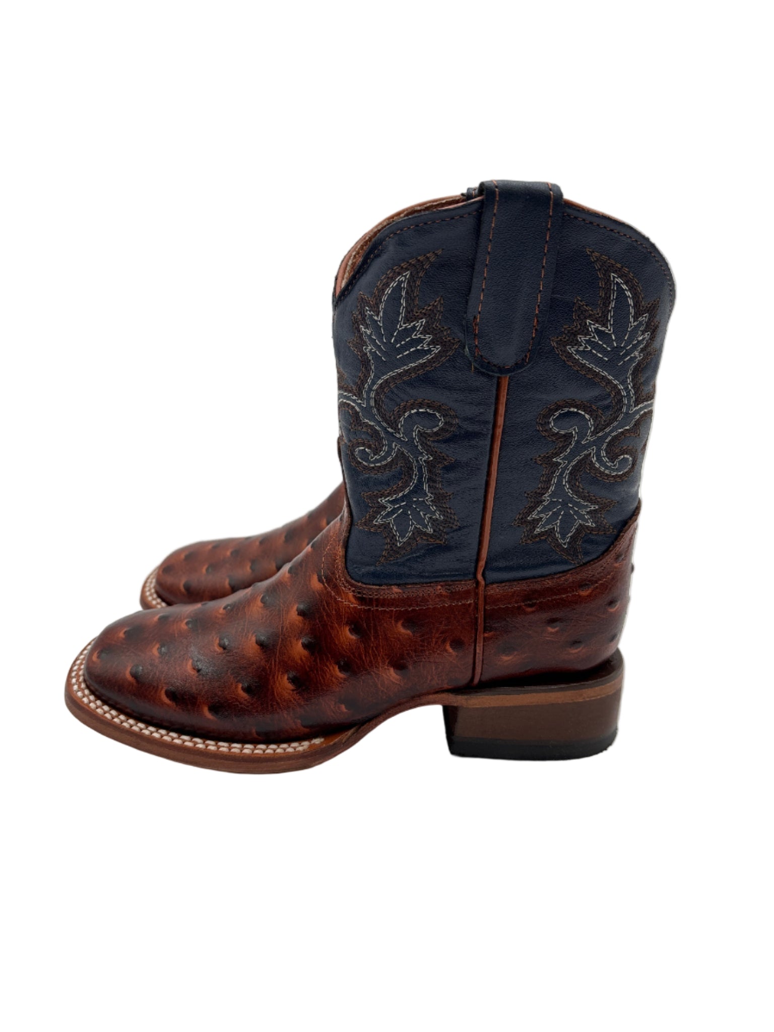 Brown leather boot with intricate stitching 