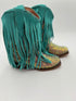 Turquoise fringe boots on a white background