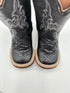 Black cowboy boots with intricate designs on a white background