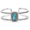A silver-colored metal bracelet with a rectangular turquoise stone in the center