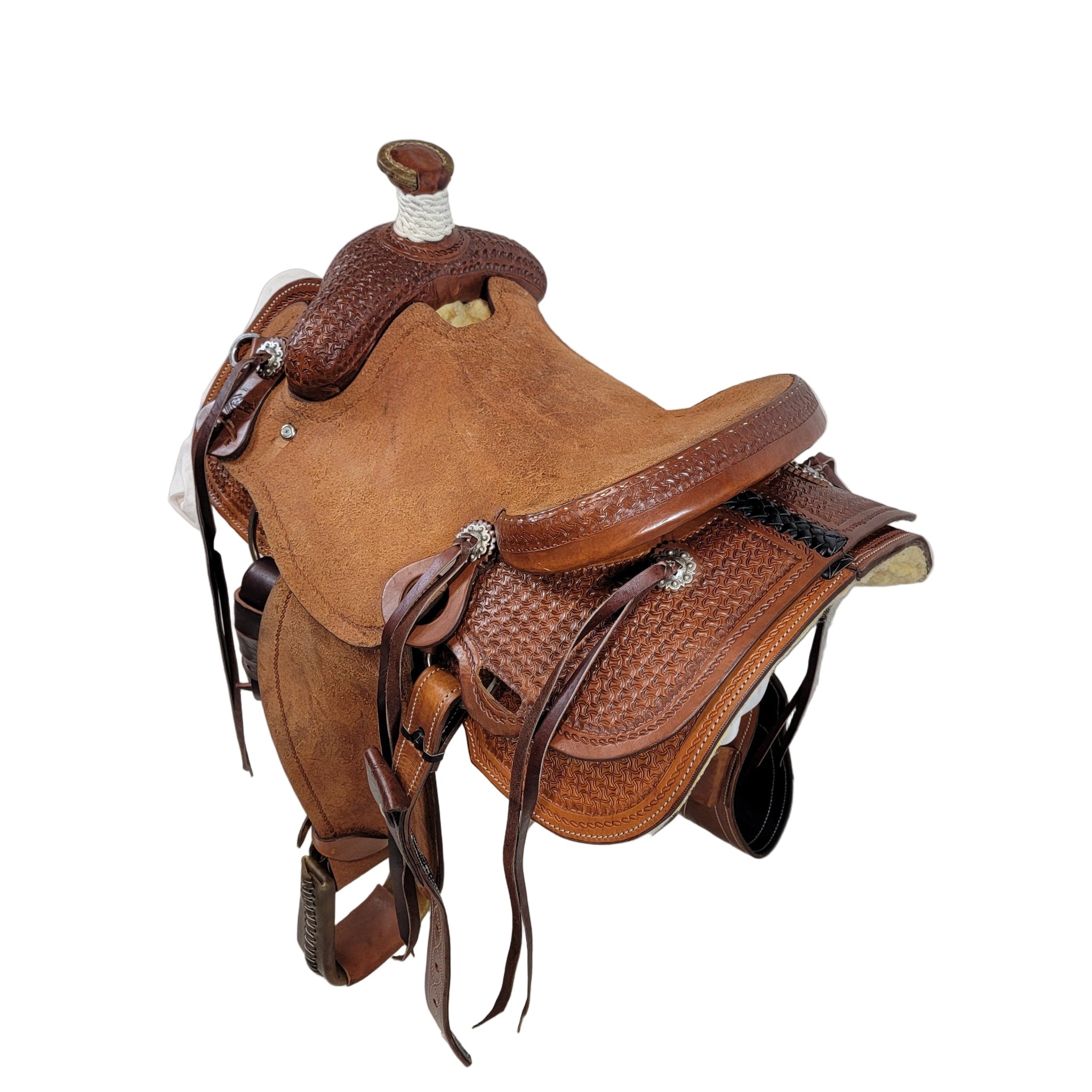 Ranch Saddle with rough out seat, cheyenne roll cantle, ornate tooling, square skirt, rough out fenders, bull hide tree, 7/8 Ring Rigging, medium oil finish, and 7" Gullet