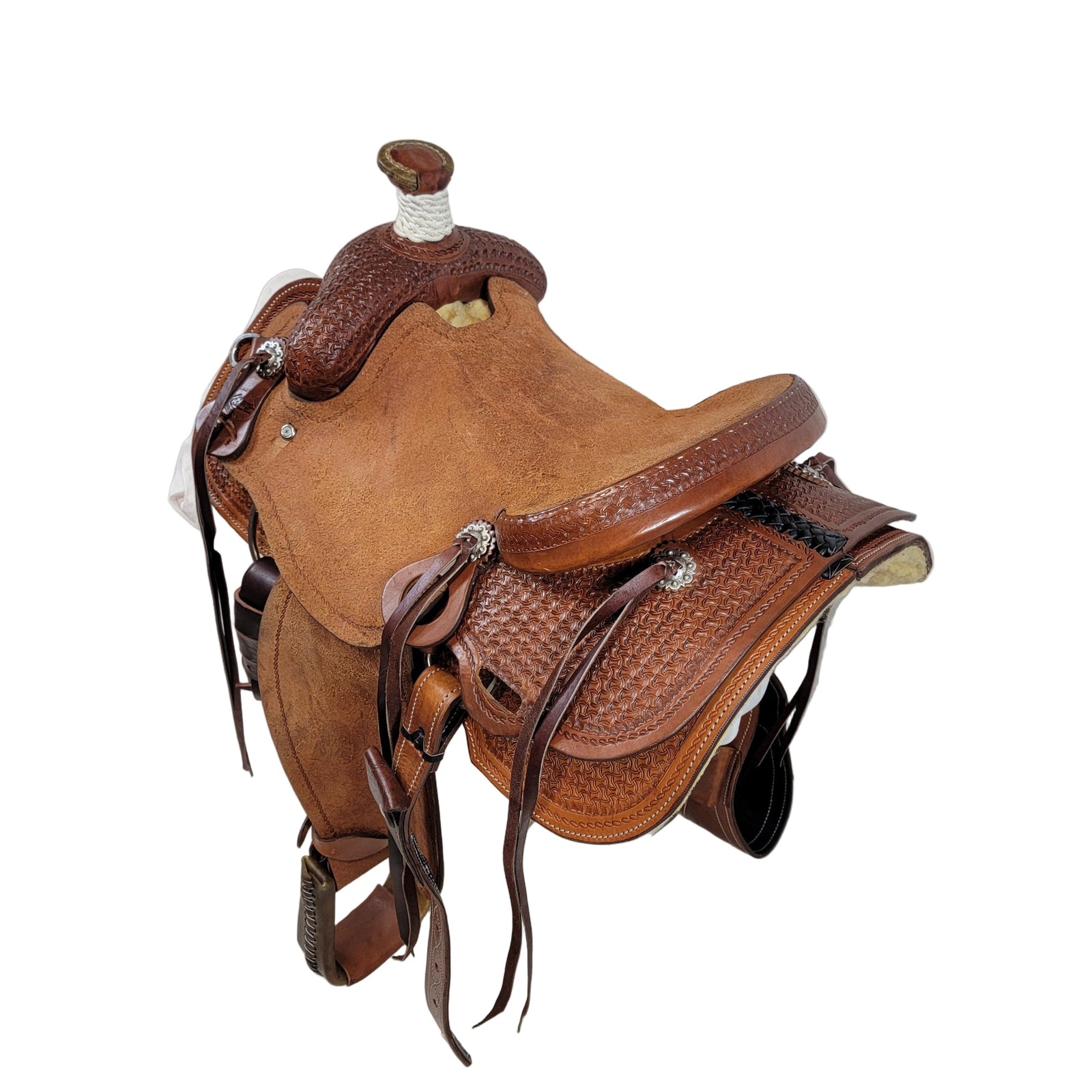 Ranch Saddle with rough out seat, cheyenne roll cantle, ornate tooling, square skirt, rough out fenders, bull hide tree, 7/8 Ring Rigging, medium oil finish, and 7
