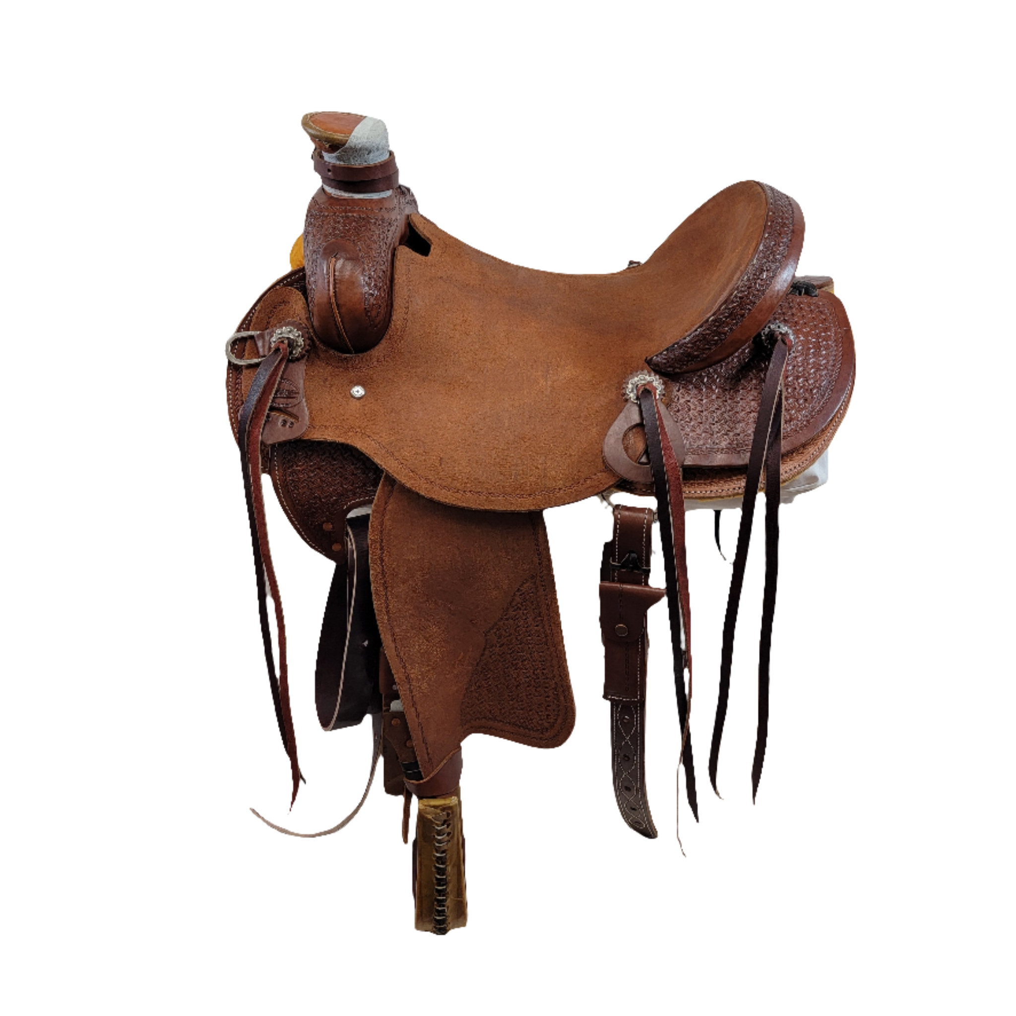 Will James Saddle with rough out seat, 5" Cheyenne Roll Cantle, ornate windmill tooling, round skirt, rough out fenders, medium oil, and bull hide tree and 7" gullet
