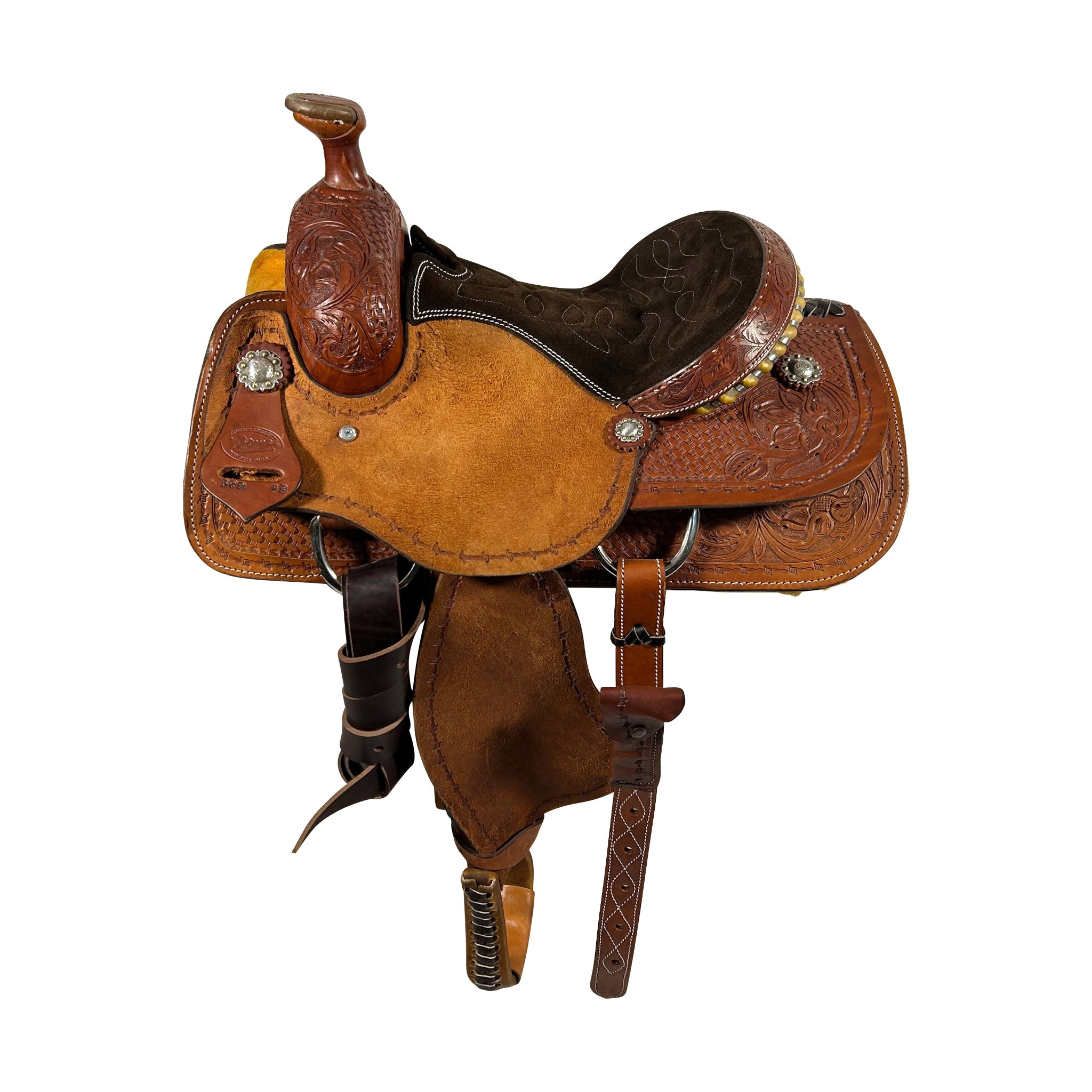A brown padded Vickers Classic 29 team roping saddle with a rawhide lace oval basket and floral hand tool, featuring a barbed wire border and rough out stirrup fenders.
