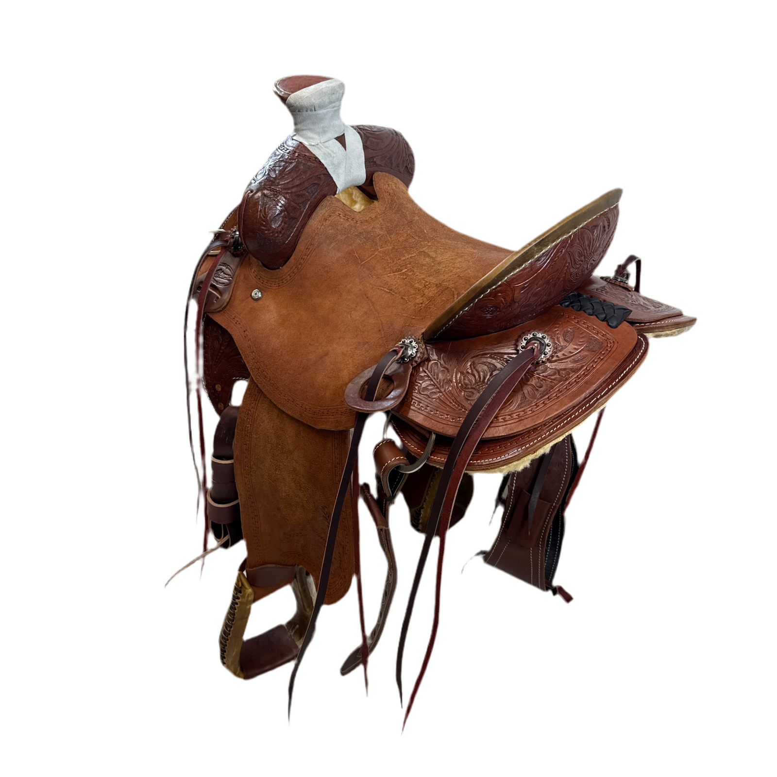 Brown leather Will James saddle with ornate tooling, and rough out seat