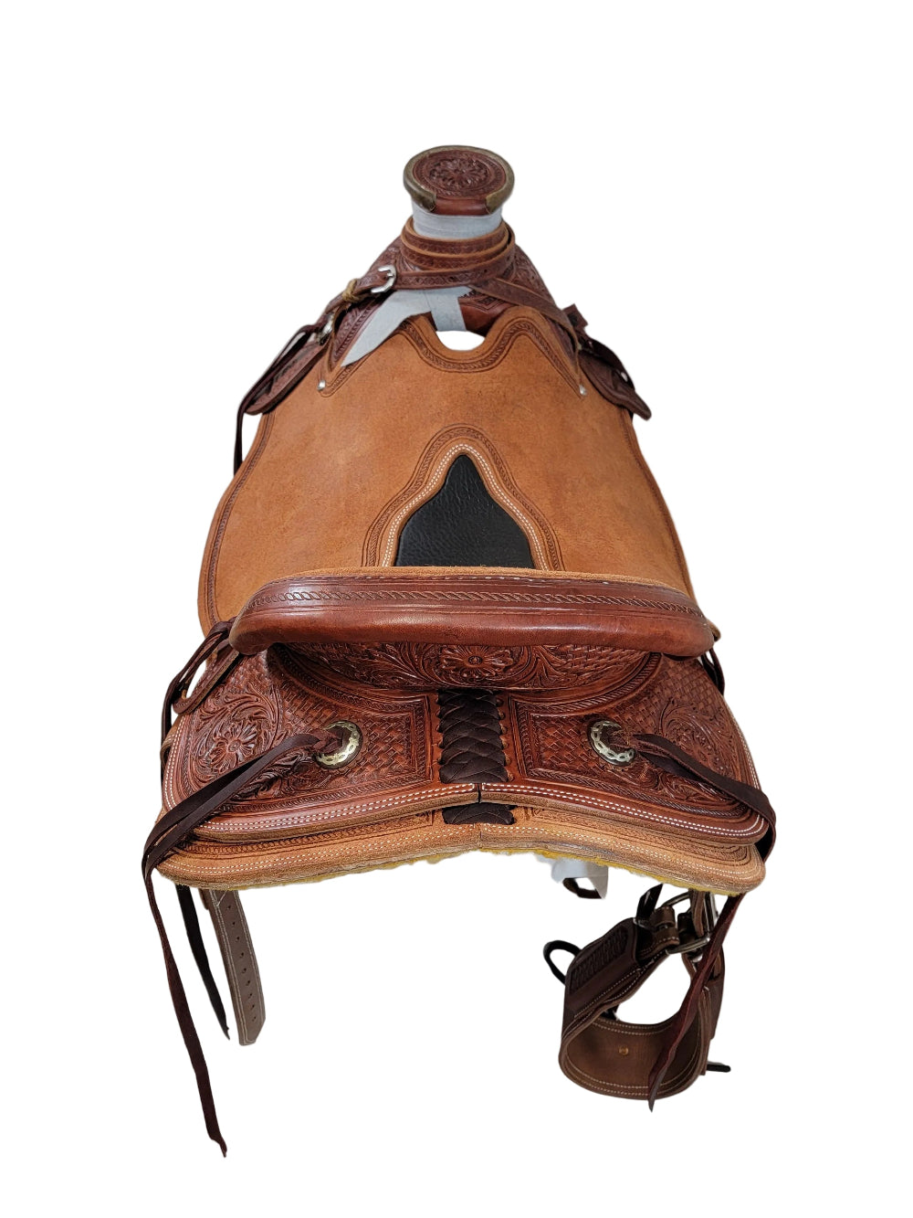 Brown leather saddle on a white background