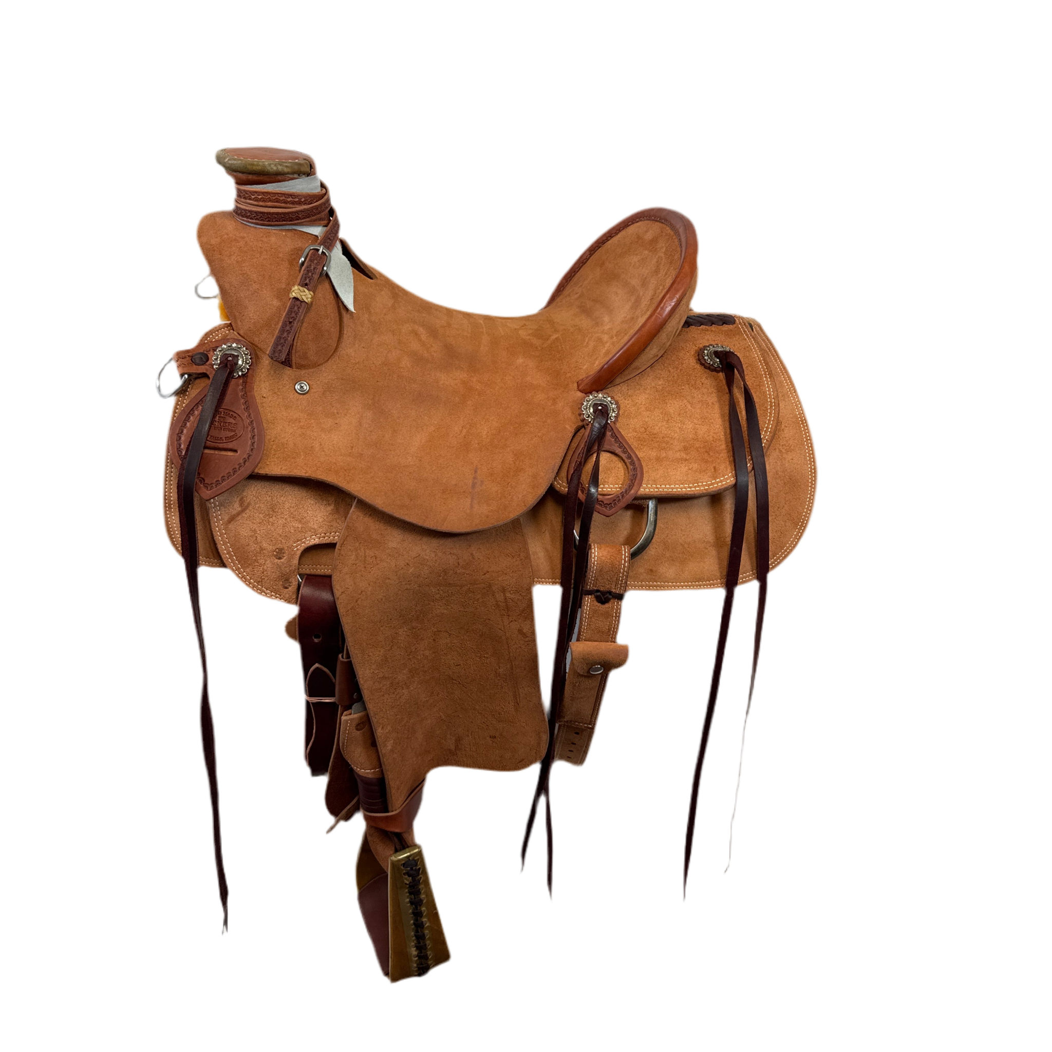 A brown Vickers Elite L20 saddle with a rough out seat, pencil roll cantle, and leather rigging.