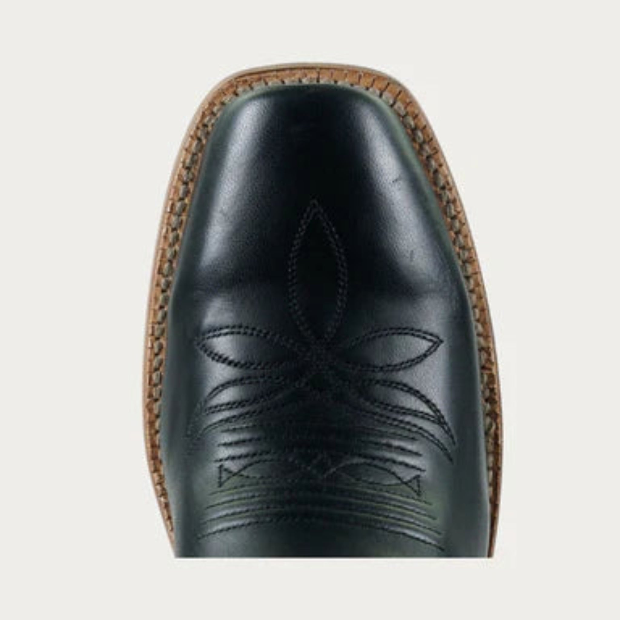 Black leather boot with intricate brown stitching on a light gray background