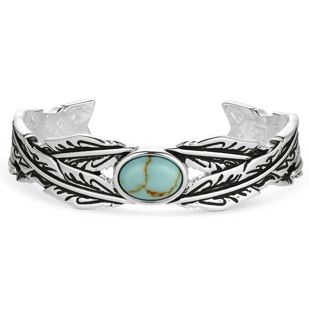 Silver bracelet with a turquoise stone on a white background