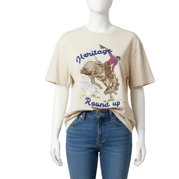 Oversized Beige t-shirt with graphic of a person riding a horse and 'Heritage Round Up' text 