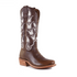 Brown cowboy boot with intricate white cutouts on upper