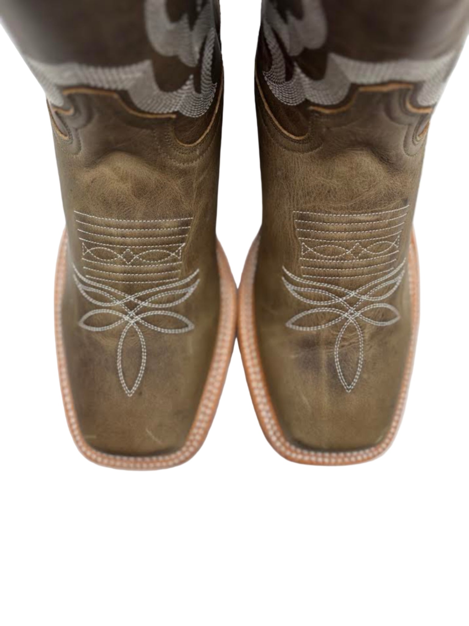 Grean cowboy boots with intricate white stitching on a white background