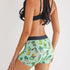 green shorts with boot pattern 