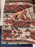 Patterned jacket with a visible Wrangler logo, worn over jeans.