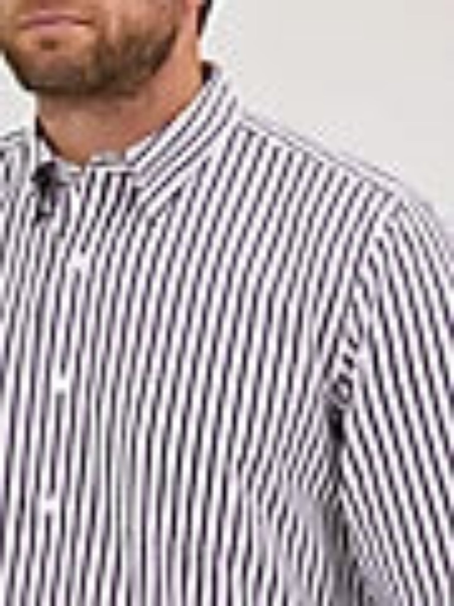 Man wearing a striped shirt with 